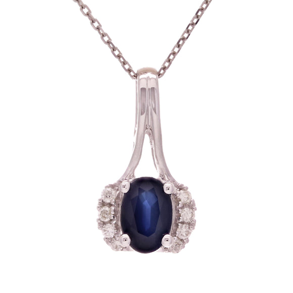 A real white gold necklace with a beautiful blue sapphire pendant.